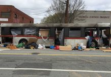 A burned out bus, part of a set for "Cordon" filming in Atlanta on Edgewood Avenue