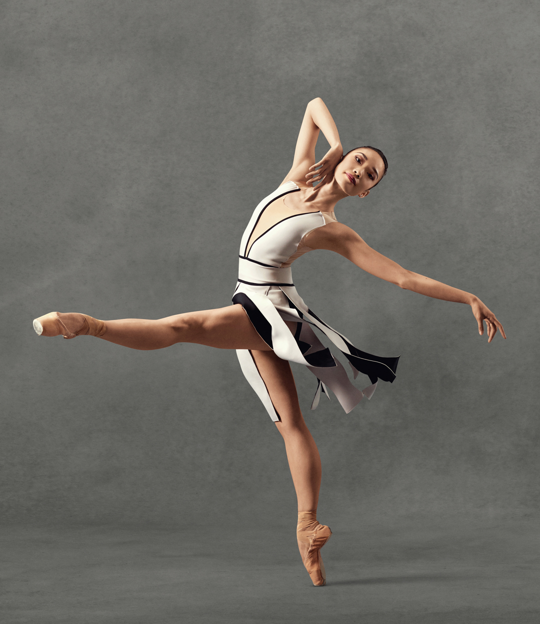 Premium Photo | A little adorable young ballerina does ballet poses and  stretching exercises on the floor at home