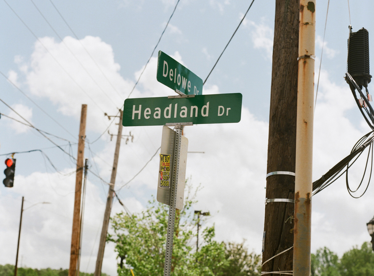 Street sign at the intersection of Headland Drive and Delowe Drive