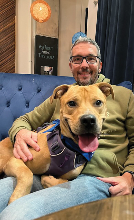 A man with his adopted dog