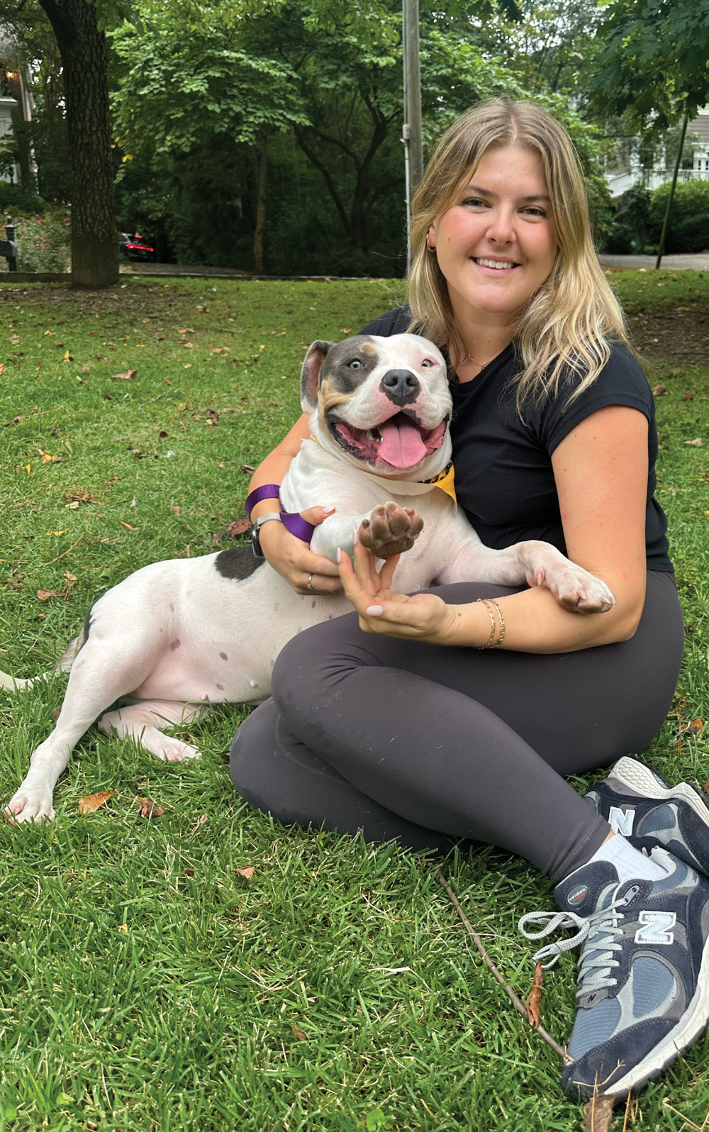 A woman with her adopted dog in the park