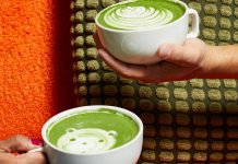 Matcha lattes with a flower and a bear drawn on top
