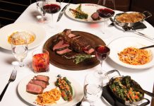 Wagyu beef tartare and a bit of bread, and a spread of bistecca alla Fiorentina, pastas, and broccolini.