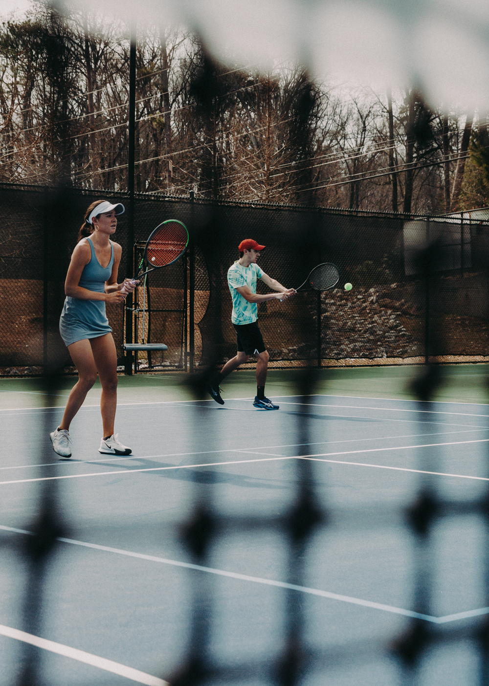 Two people playing tennis at Bitsy Grant Tennis Center