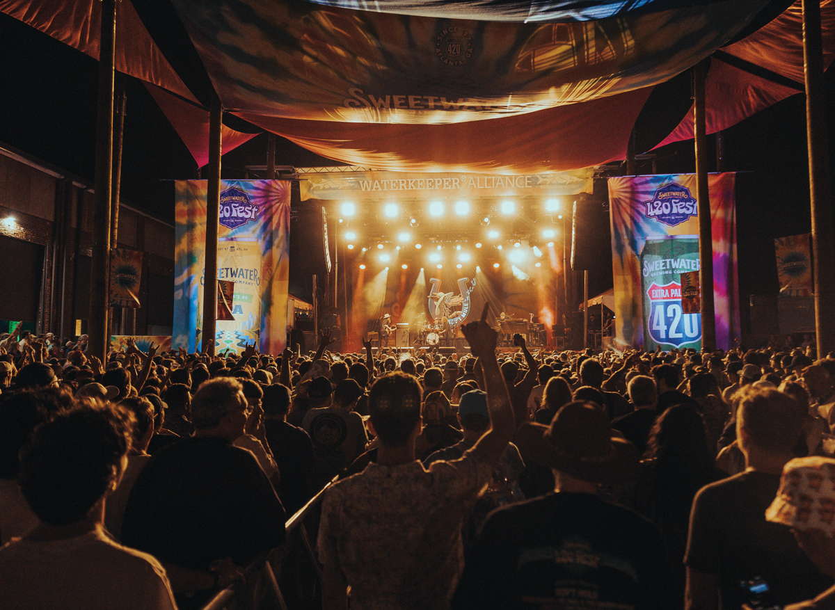 A photo in the crowd looking at the stage at Sweetwater 420 Fest