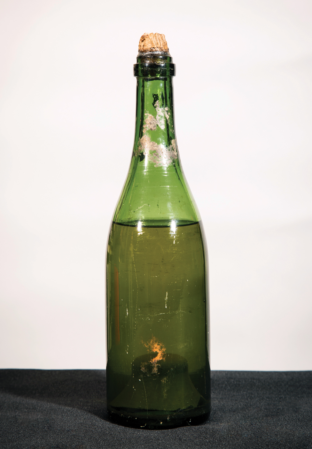 Thick glass protected this champagne bottle and its contents for decades underwater