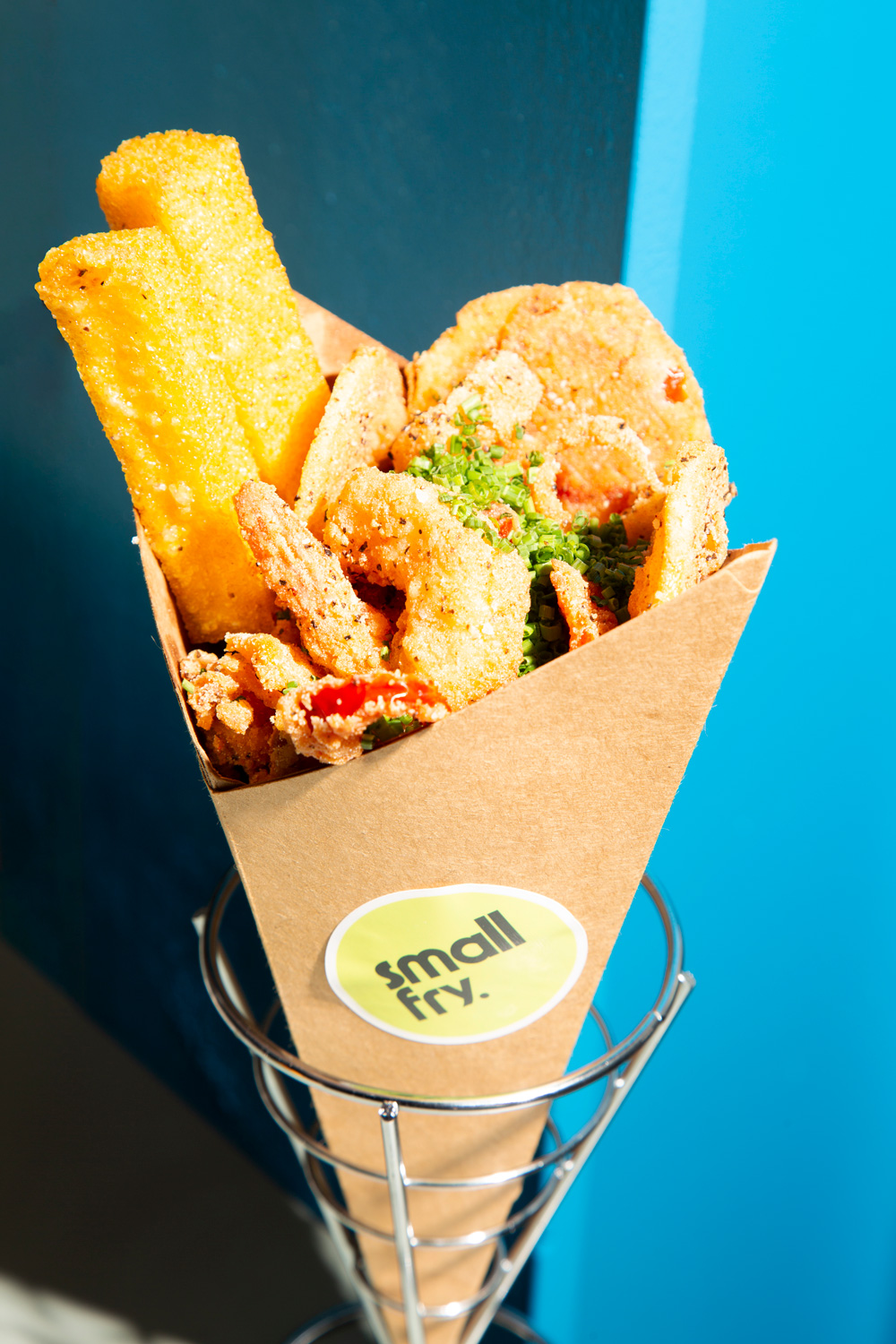 Fritto misto in a cone shaped container with a "small fry" sticker