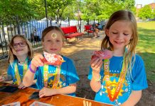 Kids show off their handmade crafts after running in the Virginia-Highland Summerfest Tot Trot.