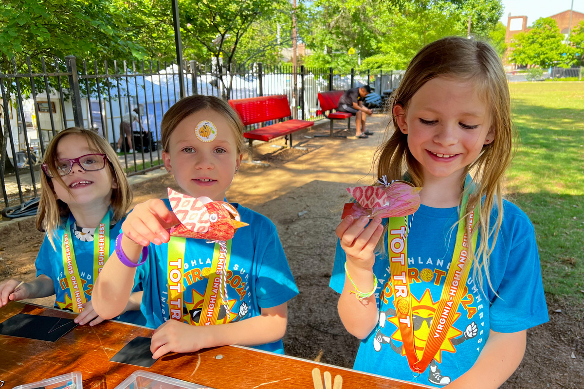 Kids show off their handmade crafts after running in the Virginia-Highland Summerfest Tot Trot.