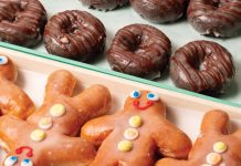 Rows of glazed, chocolate glazed, and gingerbread-shaped glazed donuts