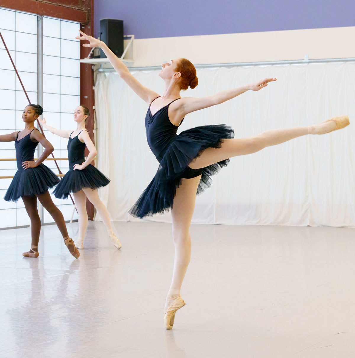 Ballet students practice the arabesque at the Michael C. Carlos Dance Centre