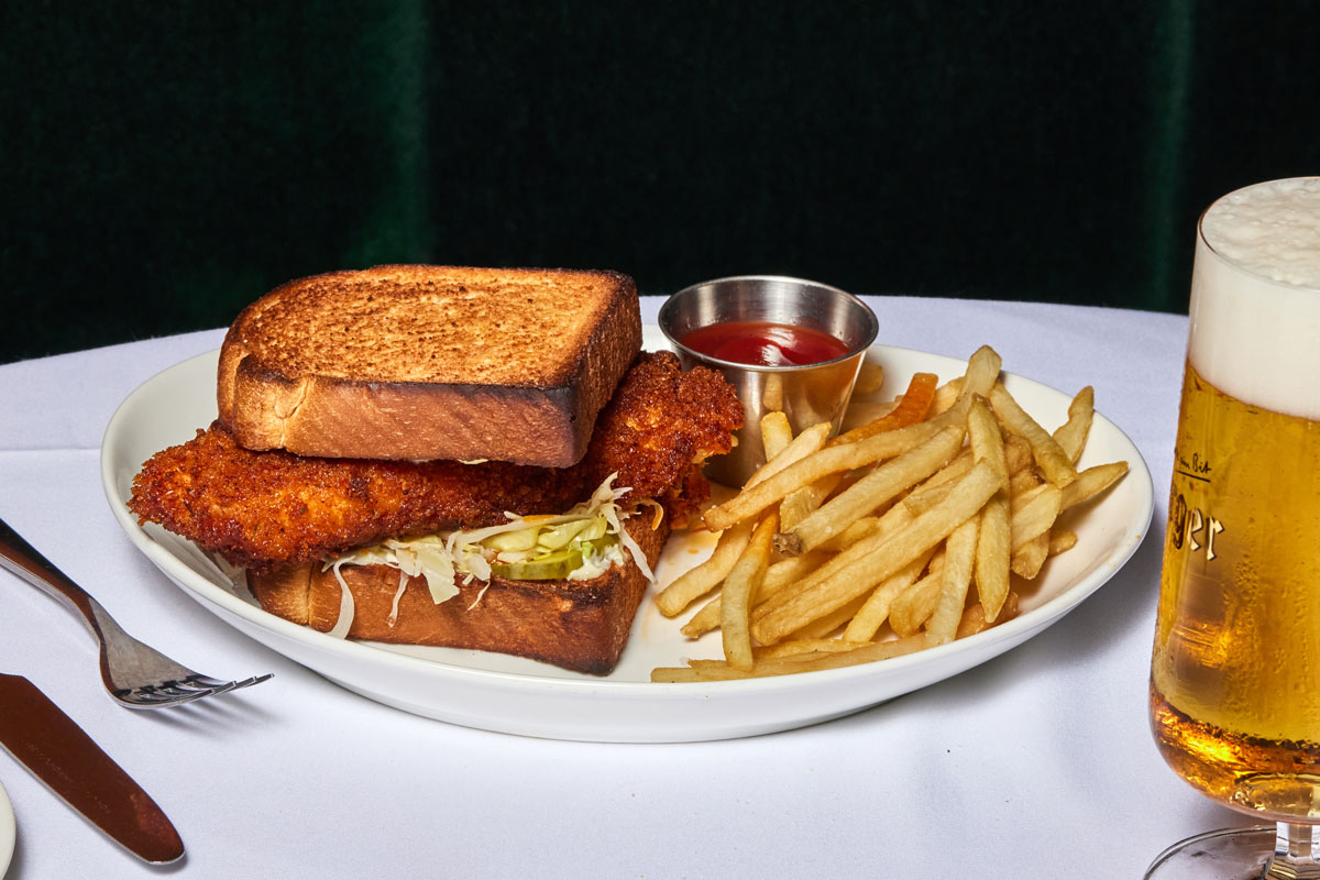 Fried fish on Texas toast served with fries, ketchup, and a beer at C&S Seafood and Oyster Bar