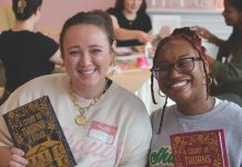 6 Atlanta bookstores where community matters as much as the books Two women smile while holding the book "A Court of Thorns and Roses"