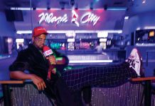 Hood Anchor Ye started reporting as a joke. Now he’s a trusted source. Carldez Goodley (Hood Anchor Ye), holds a mic and looks into the camera at Magic City