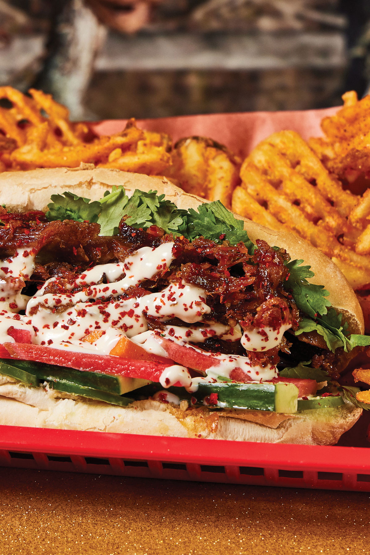 Crispy pork banh mi with waffle cut sweet potato fries