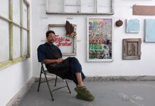 Navin Norling in his Atlanta studio with work from his upcoming exhibition, A Dangerous Game.