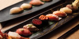 Assorted nigiri on the salvaged wood bar at Nakato