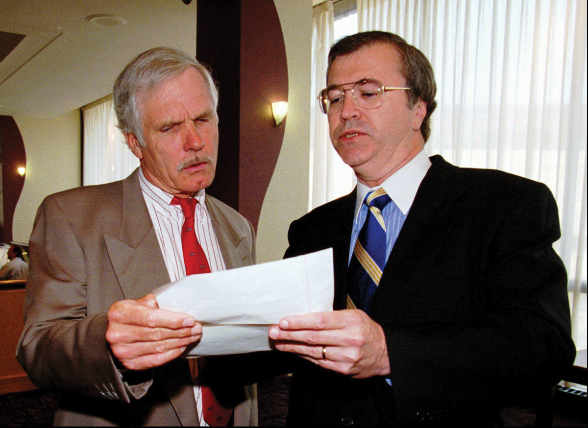 Ted Turner, left, with Johnson, then CNN president