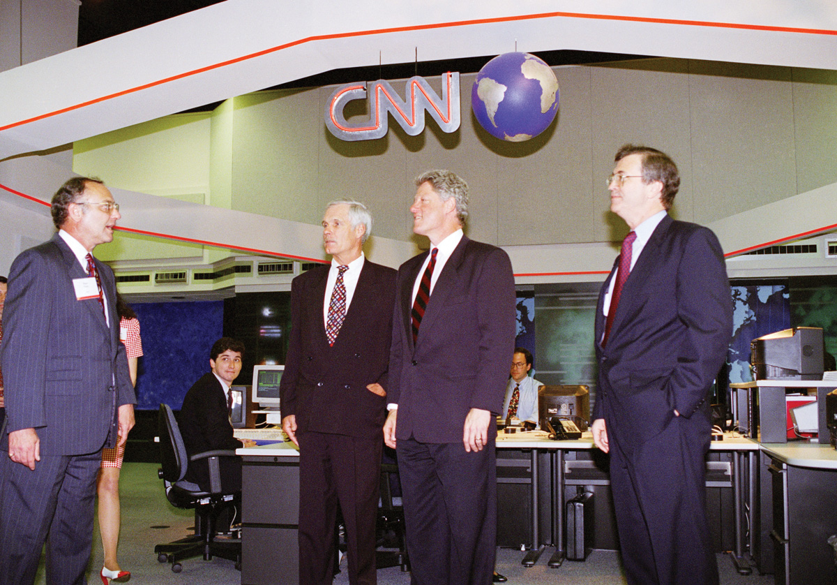 President Bill Clinton, center, tours CNN’s new Atlanta studios with Turner and Johnson, right