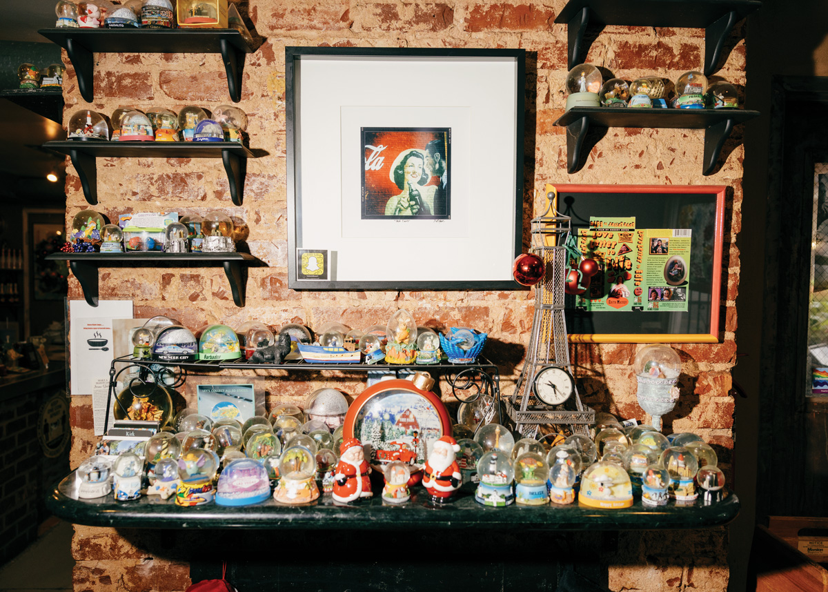 a table full of snowglobes at the inside of Babs Midtown