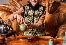 Amy Zhang wears a ceremonial vest for tea service at Wai’s Gong Fu Tea House.