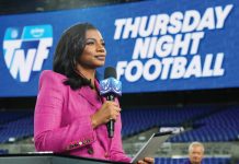 Taylor Rooks knows what makes athletes tick Taylor Rooks in a pink blazer, holding a mic