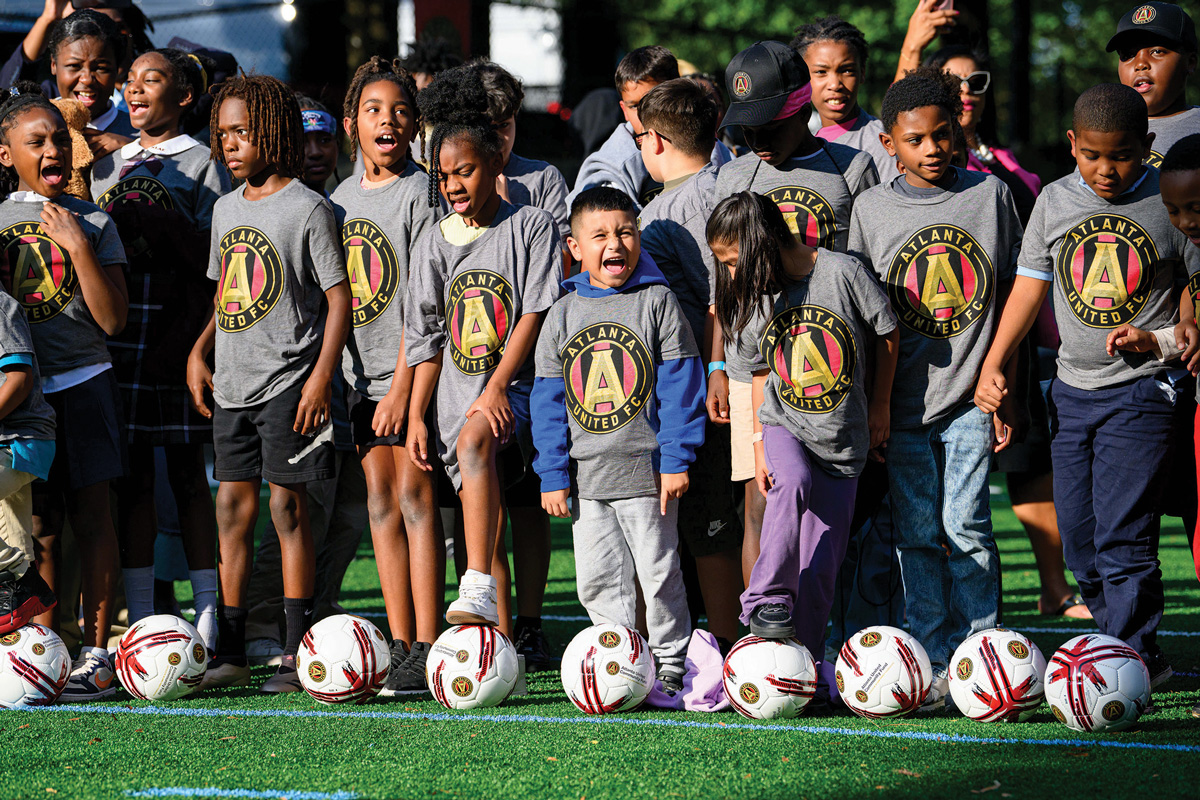 Young soccer players show their team spirit in their Atlanta United gear